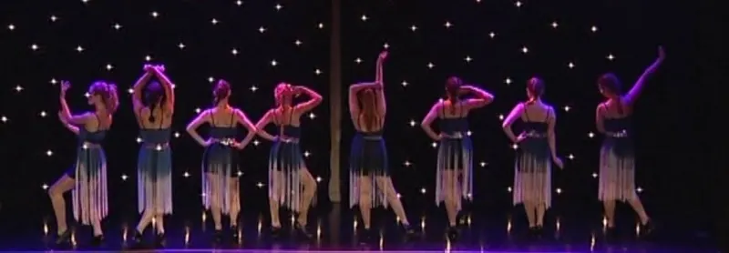 Stage-lit group routine at an annual Karen Chapman dance production