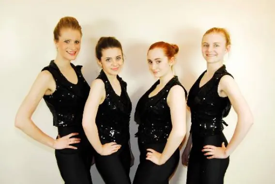 Four senior pupils in sequinned costumes at Karen Chapman School of Dancing